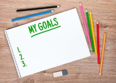 kids have paper and pencils ready to write their goals