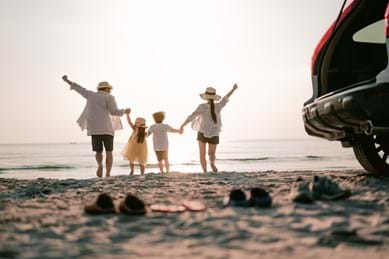 family happy day at the beach together