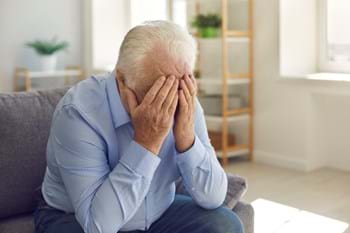 elderly man upset struggling with elder abuse