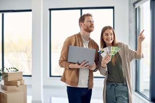 Couple choosing what colour they will paint their wall